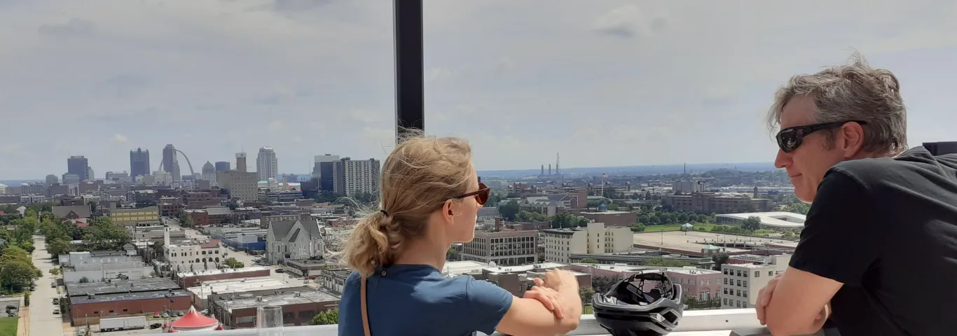 Photo of PNP grad and faculty talking